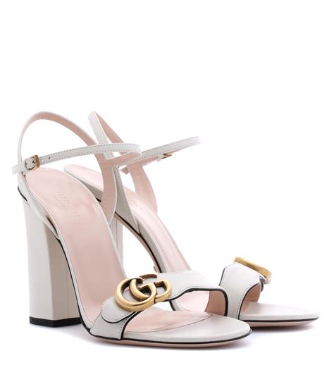 white Gucci heel sandals